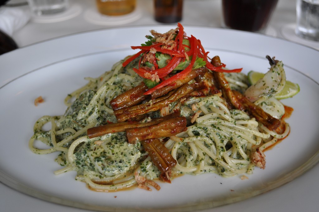 Laksa leaf pesto - pasta tossed with laksa pesto, coconut cream and fishcakes, topped with green bean sambal, coririander and chilli