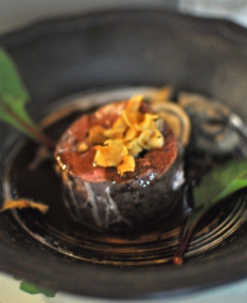 Deer in the forest - venison and mushroom crepinette, spinach, pine nuts, chocolate soil, growing mushrooms, game chips