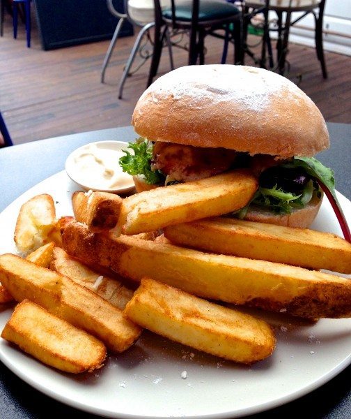 The A&C hamburger - vintage cheddar, crispy bacon, spicy tomato relish & chips $14.90